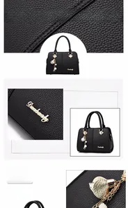 Detail of lychee pattern leather handbag with golden hardware and leaf tassel charm