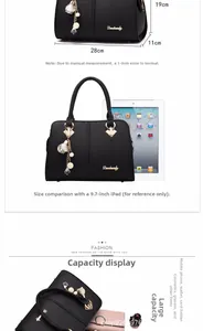 Detailed view of black pebbled leather tote bag with 28x19x11cm dimensions and large capacity