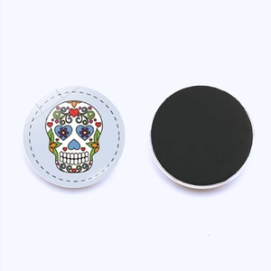 Skull glass magnet for fridge or whiteboard featuring Dia de los Muertos colorful pattern