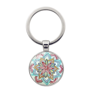 Detailed macro view of the silver metal keychain with colorful mandala glass pendant