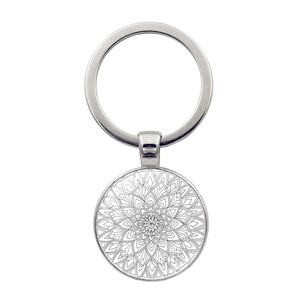 Detailed view of silver mandala glass gem pendant with intricate floral pattern