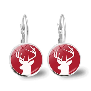 Detail of red and white reindeer pattern drop earrings with silver leverback closure