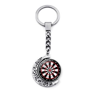 Close-up of rotatable dartboard keychain with silver crescent moon hollow design