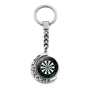 Detailed macro view of rotating dartboard pendant on crescent moon silver keychain