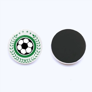 Macro view of 25mm soccer crystal glass fridge magnet with green laurel and stars