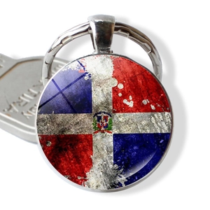 Close-up of Dominican Republic flag keychain with vintage glass cabochon effect