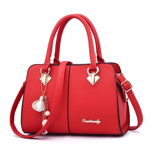 Elegant red leather handbag with gold accents and detachable shoulder strap for women
