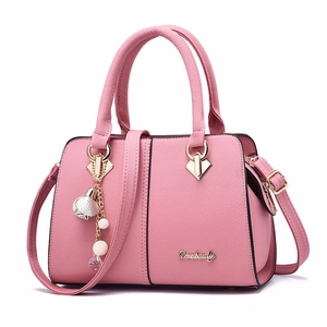 Pink crosshatch synthetic leather handbag with dual handles and elegant pearl charm