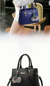 Detailed close-up of textured leather handbags with metallic handles and leaf charms