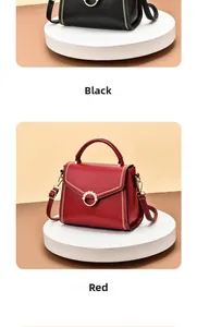 Detail view of leather tote bags in black and red with elegant pearl ring hardware