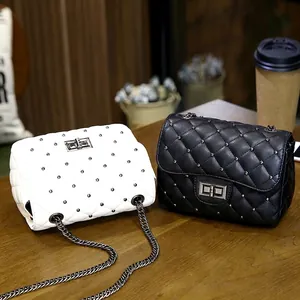 Quilted crossbody bags with studs and chain straps in classic black and white colors