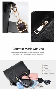 Detailansicht der großen Handtasche mit Krokodilprägung, Metallbeschlägen und Innenraum