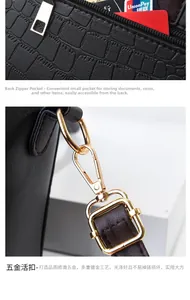 Details einer Handtasche mit Kroko-Prägung, Goldbeschlägen und Sicherheits-Reißverschluss