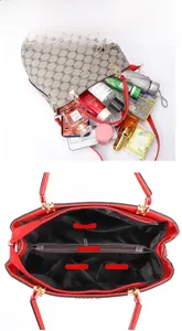 Internal structure of the handbag showing multiple compartments and storage pockets
