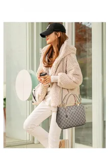 Asian model wearing a grey patterned large capacity tote bag with beige top handles