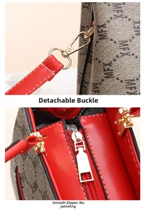 Detail of detachable gold hook and smooth zipper on a grey textured monogram bag