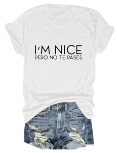 Flat lay of a white cotton t-shirt with black letter print and distressed denim shorts