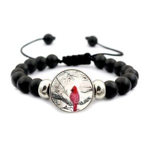 Black beaded cardinal bird bracelet with adjustable drawstring and silver metal spacers