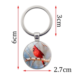 Cardinal bird keychain with glass dome pendant showing winter bird and size dimensions