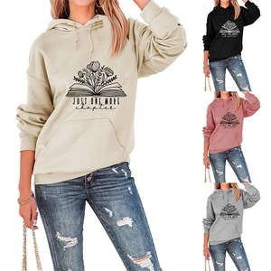 Detail view of colorful hoodies collection with floral book print and drawstring hood