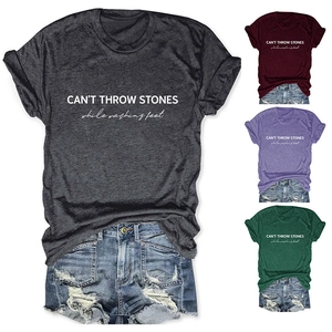 Detail of summer casual t-shirt with Can't Throw Stones print and denim shorts