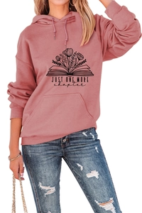 Detail of Just One More Chapter print on rose pink hoodie with drawstring and pocket