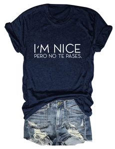 Detail of navy blue T-shirt with I'M NICE white text and distressed denim shorts