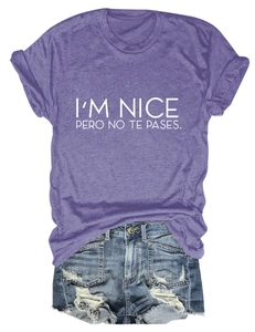 Detailed flat lay of purple I'M NICE printed T-shirt and distressed blue denim shorts
