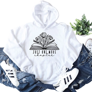 Detail of Just One More Chapter print on white hoodie with floral book graphics
