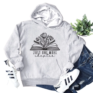 Flat lay of gray Just One More Chapter hoodie with book and floral art print details