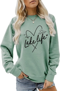 Detail view of the soft sage green fabric and Lake Life graphic print on the sweatshirt