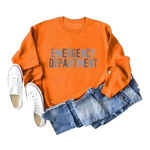 Flat lay of an orange crewneck sweatshirt with blue Emergency Department lettering detail