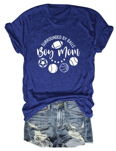 Detailed flat lay of navy 'Boy Mom' T-shirt with sports ball icons and denim shorts