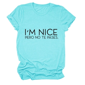 Detail of light blue crew neck T-shirt with black I'M NICE PERO NO TE PASES text print