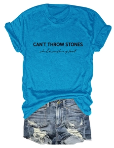 Flat lay of blue cotton t-shirt with letter print and distressed denim shorts