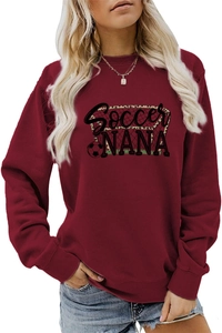 Close-up of Soccer NANA graphic print on casual burgundy crewneck sweatshirt for women