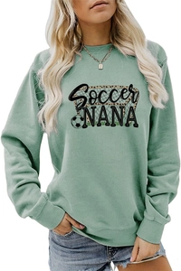 Detail view of Soccer NANA print on a sage green crewneck sweatshirt with ribbed cuffs