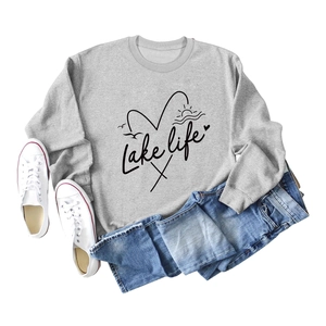 Detailed view of the Lake Life screen-printed pattern on a light grey casual sweatshirt