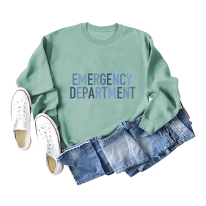Detailed close-up of sage green sweatshirt texture with Emergency Department lettering