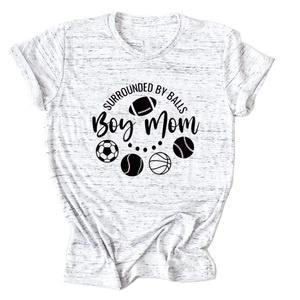 Close-up of Heather Grey Boy Mom T-shirt featuring sporty balls graphic print