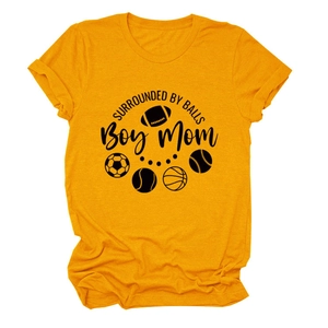 Close-up of yellow cotton t-shirt with Boy Mom sport balls print and rolled sleeves