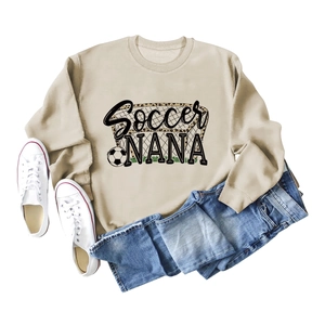 Soccer Nana sweatshirt with football leopard print paired with blue jeans and sneakers