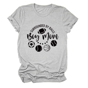 Detailed view of gray cotton t-shirt featuring sports ball graphics and Boy Mom text