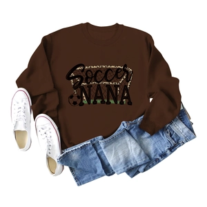 Close-up of Soccer NANA print with leopard details on brown cotton sweatshirt fabric