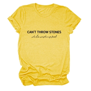 Detail of CAN'T THROW STONES print on a yellow cotton casual short sleeve t-shirt