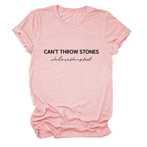 Detail of pink cotton blend t-shirt featuring black CAN'T THROW STONES slogan print