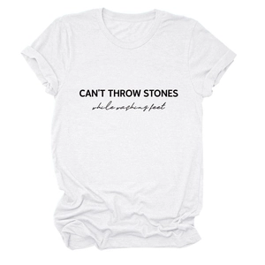 Detail of CAN'T THROW STONES text print and rolled sleeves on white cotton T-shirt