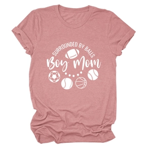 Detailed view of dusty rose tee with SURROUNDED BY BALLS Boy Mom print and sports icons