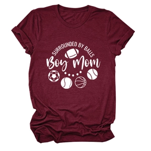 Close-up of burgundy heather T-shirt featuring Boy Mom and sports ball graphic print