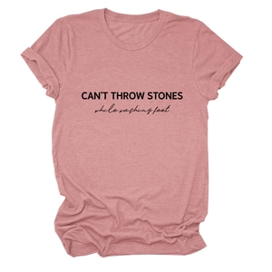 Detail of dusty pink cotton t-shirt featuring CAN'T THROW STONES black printed slogan